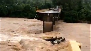 Hurricane Eta flooding washes away bridge