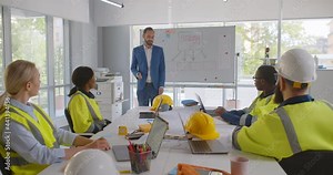 Construction company executive presenting new project to architect team