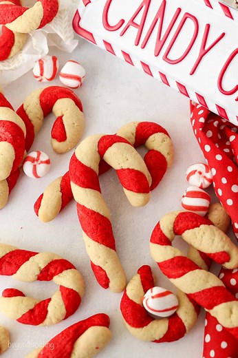 Candy Cane Cookies bring a festive twist to classic sugar cookies! 🎄✨ These adorable red-and-white treats are flavored with peppermint, making them as delicious as they are cute. Perfect for holiday baking! 🍪❤️ GET THE RECIPE ➡ https://beyondfrosting.com/candy-cane-cookies/ #cookies #christmascookies #candycanes #easycookies #lovetobake | Beyond Frosting