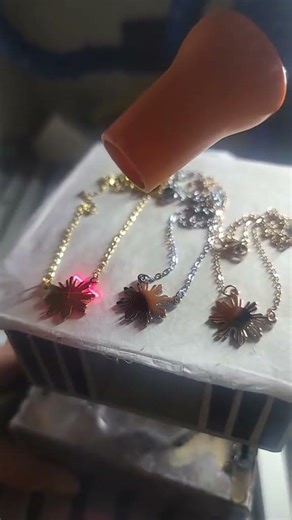 Engraving German Eagle on a Philippine Sun Necklace