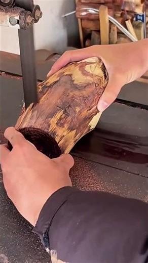 cutting wood precisely using a band saw and focusing on creating a circular shape