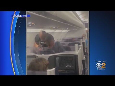 Video shows Mike Tyson punching man on plane