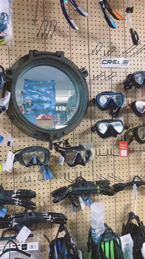 The mask wall is a work of art that changes every day-o 🤿 #discoverydiving #beaufortnc #scubadiving #scubagear | Discovery Diving