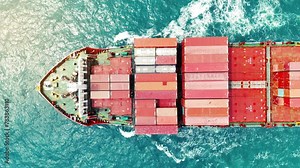 Cargo Container experss ship running very fast in the ocean. Container ship carrying container import export concept technology freight shipping by ship. aerial top of express Container Vessel