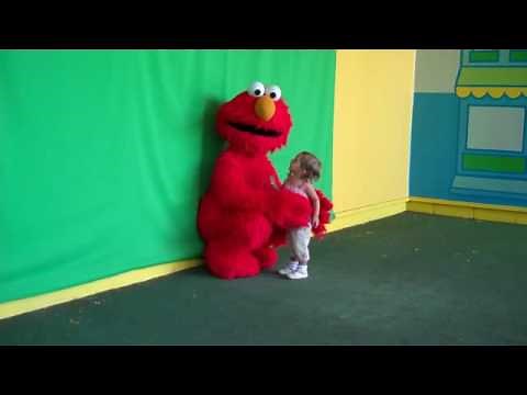 Sesame Place - Emma hugging Elmo