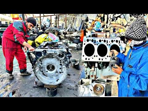 Engine Rebuild in Progress - Skilled Mechanics Restoring a Heavy - Duty Motor
