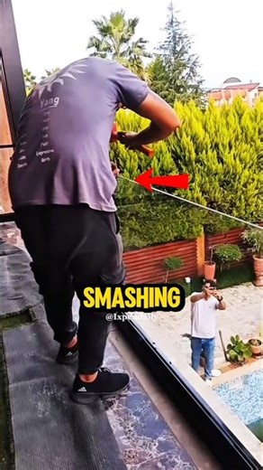 Why Is He Smashing a Glass Railing?