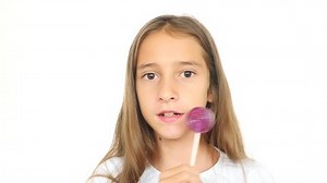 Little Girl Licks Lollipop Stares Into Stock Footage Video (100% Royalty-free) 31758430 | Shutterstock