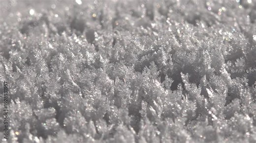 Crystal hoarfrost rime layer accumulated on a cold winter surface, serene and beautiful. Humid air freezes into sharp ice formations, creating natural frost texture, calm and soothing.