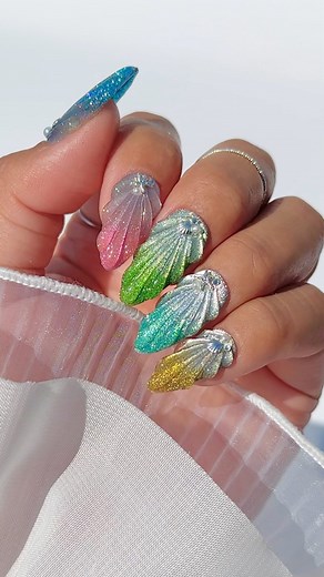 Daily Charme Official on Instagram: "Nail Tutorial: EASY & TRENDY 3D Seashell Nails holo twinkle x cat eye edition 😻✨🐚 Comment “SUMMER SEASHELL” for everything you need to create this look! ☀️🌈 Save & share for inspo! ✨ ✨ ✨ #cateyenails #holonails #summernails #3dnails #howtonails #diynails #nailtutorial #nails #nailart #mermaidcore"