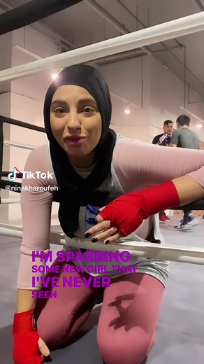 Female Fighter's Intense Sparring Session at the Gym