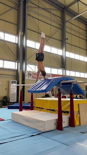 Young Male Gymnast Performs Incredible High Bar Tricks