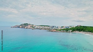 Aerial top view of Spanish mansions, resorts and spas, restaurants and hotels. Panoramic view of Cala Agulla, Es Pelats and Cala Lliteres towns with blue water on Majorca, Balearic Islands, Spain