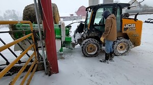 Feeding frozen silage bales with a skid steer? ☃️ 🤯 Yes sir! Easy as for this first time operator! https://bit.ly/3Dt8kov | Hustler Equipment