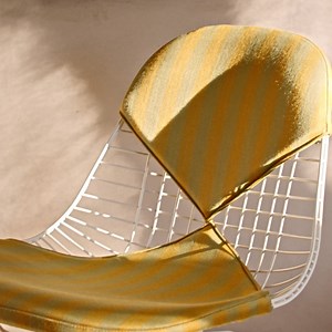 The New Mexico Collection was inspired by the creative camaraderie among Alexander Girard, Charles and Ray Eames, and New Mexico’s most well-known resident of nearly 40 years, the artist Georgia O’Keeffe. Undertaken in partnership with the Georgia O’Keeffe Museum, the collection features the Girard Snake Table, designed by Alexander Girard but never before put into production, and a special version of the Eames Wire Chair Low Base, designed by Eames Office, featuring Girard Toostripe in Ochre Da