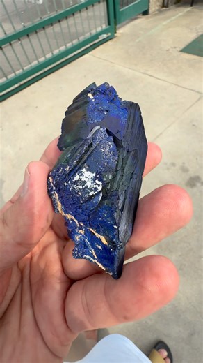 ❇️Mineral: Azurite with Malachite ❇️Cabinet: LWD: 9.5 x 4.5 x 2 cm Weight: 110 g ❇️Locality Oumjrane Mining Area, Tinghir Province, Draa-Tafilalet Region, Morocco. ❇️Description: A superb crystal of azurite exhibiting a deep royal blue color with exceptional luster and sharp form. The surfaces show intricate growth patterns and fine textural detail, transitioning from silky, velvety zones to highly reflective faces that glimmer in light. Subtle hints of green malachite add a touch of contrast an