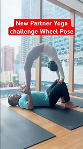 New challenge partner yoga wheel pose