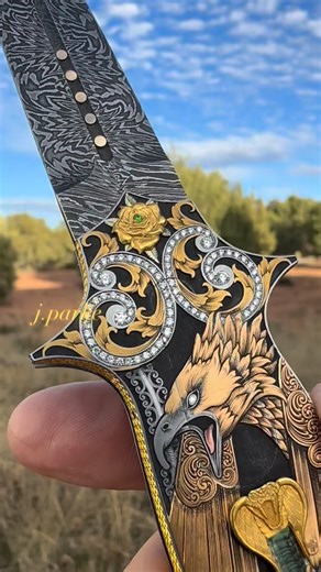 Jeff Parke on Instagram: "“The dragon reborn” @rickgenoveseknives auto dagger illuminated in precious metals and magick… #jparke #artistjeweler #masterengraver"