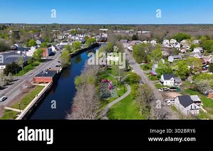 Robertson Mill building aerial view on Taunton River at the center of Weir Village, city of Taunton, Bristol County, Massachusetts MA, USA.