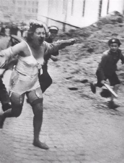 Macabre Knowledge on Instagram: "A Jewish woman runs from men and youth with clubs during the Lviv pogroms in 1941. The Lviv pogroms were the massacre of Jews in June and July 1941 in the city of Lwów in German occupied Eastern Poland/Western Ukraine (now Lviv, Ukraine). It was carried out by Ukrainian nationalists, German death squads, and the urban population during the German invasion of the Soviet Union. You won’t believe what they did to her after she was caught... Visit bio link"
