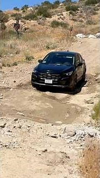 2025 Subaru Crosstrek(base model) driving down a steep dirt hill