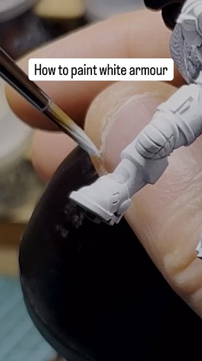 This is how I paint my white armour. It’s slow only because I’m layering over wet paint, so I stick to one panel at a time. The actual application is pretty quick — you’ve got to move fast while it’s still wet — and it leaves the recesses nice and dark with a smooth finish. #warhammer40k #miniaturepainting #warhammercommunity #paintingwarhammer #warhammer #tabletopgaming #paintingminiatures #whitescars #spacemarines | Imperial Heresy