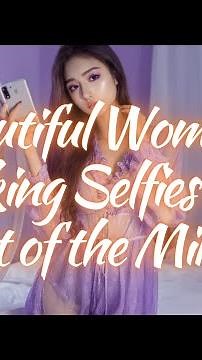 Beautiful Woman Taking Selfies in Front of the Mirror