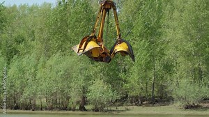 Large digger on a barge dredging and deepening the river for ships to pass. Cleaning and deepening the river for navigation. Dredging boat is working to deepen the fairway on the river