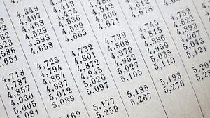document with many numbers, data encrypt. Cipher encryption code or data, closeup