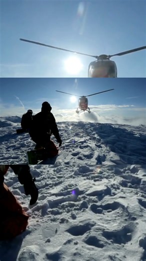 The helicopter left skiers on the slope of the mountain and flew raising a cloud of snow