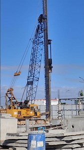 Deep Foundation Work: Massive Hydraulic Pile Driver Operating