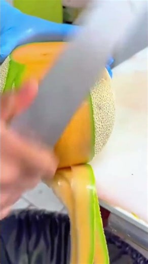 Satisfying Video of Professional Chef Expertly Peeling Cantaloupe With Sharp Knife