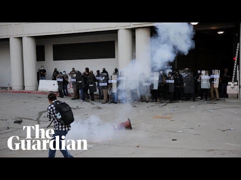 LA police clash with protesters at federal detention centre after Ice raids