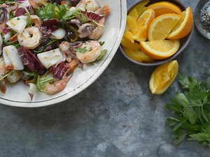 Laura Vitale uses shrimp and calamari to make a gorgeous grilled seafood salad. Make this recipe: http://www.cooktv.com/5sdqe | Cooking Channel