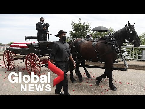 John Lewis’ funeral procession crosses the Edmund Pettus Bridge in Selma, AL