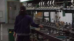 Woman checking silk cocoons during stoving process, Sericulture in Suzhou factory, China