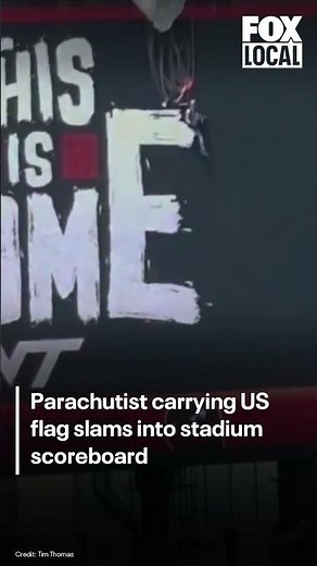 Parachutist carrying US flag slams into Virginia Tech stadium scoreboard