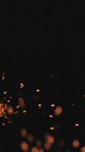 Sparks of fire on a black background - Free Stock Video