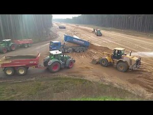CAT 966C Wheelloader loading Fendt Vario's