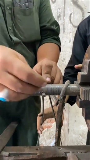 Coiling a metal wire around a shaft rod shape