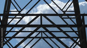Detail of electrical pylon with clouds moving behind steel girders. Stock Video