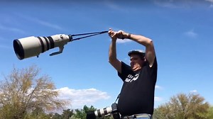 Guy Swings Huge $10,000 Lens Around His Head in Crazy Strength Test