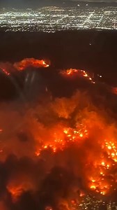 A flight passenger traveling from Denver to Los Angeles captured footage of the Palisades Fire tearing across neighborhoods as the plane was making its descent into Los Angeles International Airport. The plane was originally going to land in Burbank, but was diverted to LAX. There are now four major wildfires across the Los Angeles area, including the Palisades Fire which has grown to about 11,000 acres. https://cbsn.ws/4gKYn4w | CBS News