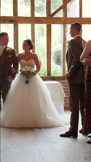 bride and groom walk up the aisle