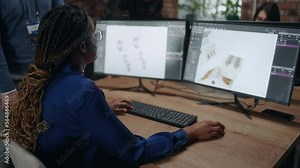 female engineer working with CAD program, creating and examining 3D model, innovation and technology