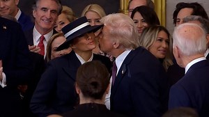 Melania's hat comes between kiss with Donald Trump at inauguration