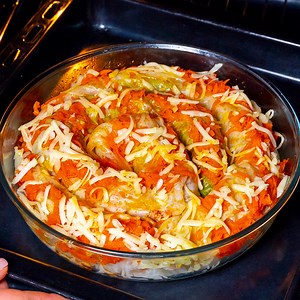 Do you have cabbage and minced meat? Heat the oven for this great recipe! Ingredients: cabbage - 1 piece In the microwave for 15 min for the filling: minced meat - 500 g (17.64 oz) onion - 1 piece carrot - 1 piece mushrooms - 150 g (5.3 oz) tomatoes - 100 g (3.5 oz) rice - 150 g (5.3 oz) salt - 10 g (0.35 oz) black pepper - 8 g (0.29 oz) for the saute: carrot - 100 g (3.5 oz) tomato paste - 60 g (2 oz) pressed cheese - 50 g (1.76 oz) Tray diameter 26 cm (10.24 in) IN THE OVEN 180 °C (356 °F)/40 