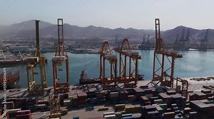 Container Cargo Ship With Industrial Crane Bridge In Manzanillo Port, Colima, Mexico - drone shot