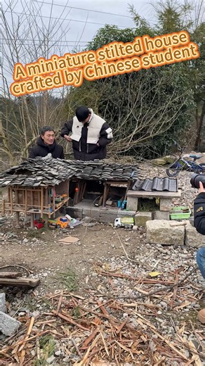 A Chinese student spent a week crafting a miniature stilted house of the Tujia ethnic group with waste wood. #China #miniature #building #handicraft | China Xinhua News