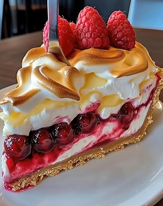 Lemon Raspberry Meringue Cheesecake Tangy, sweet, and beautifully topped with fluffy meringue — this cheesecake is a showstopper! A vibrant mix of lemon and raspberry flavors, perfect for spring, summer, or any special occasion. 🍰 #LemonCheesecake #RaspberryDessert #MeringueCheesecake #ElegantDessert #FruitLovers | Optimal Recipes